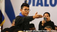 16.05.2018 Student representative Lesther Aleman interrupts Nicaragua's President Daniel Ortega, shouting that he must halt the repression, during the opening of the national dialogue, on the outskirts of Managua, Nicaragua. Order it now, in this moment, the repression of the police, of the paramilitary forces, of your party's gangs that have been massacring and killing.... In less than a month you've ruined the country; Somoza took years. Aleman said, alluding to dictator Anastasio Somoza whose government was toppled by the Sandinista rebels in 1979. (AP Photo/Alfredo Zuniga) |