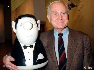 Vicco von Bülow mit der Büste der Hauptfigur seiner Karikaturen - einem korrekt gekleideten Strichmännchen mit Knollennase (1993)