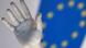 The hand of a status seen against the EU logo at the EU Council HQ in Brussels The hand of a status seen against the EU logo at the EU Council HQ in Brussels