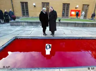 Swedish artists Gunilla Skoeld Feiler, left, and Israeli born Dror Feiler with their restored art installation, Snow White and the Madness of Truth.
