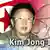Presidenti Kim Jong Ir para një flamuri me simbolin atomik të Koresë së Veriut