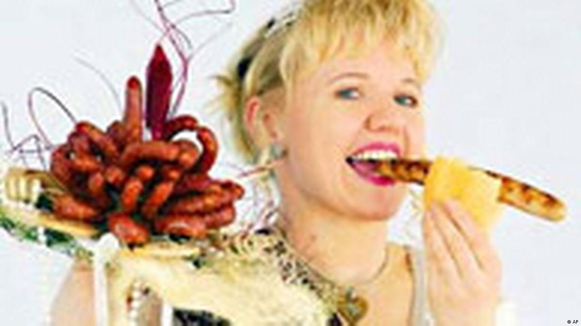woman eating sausage