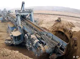 A grab works in the Heidaigou Open Mine of Jungar Energy Co, Ltd. of Shenhua Group in Hohhot, north China's Inner Mongolia Autonomous Region Tuesday, Aug. 5, 2003. The mine produced 7.91 million tons of coal in the first half of 2003, accounting for 61.75 percent of the production plan for the year. (AP Photo / Xinhua, Wang Yebiao)