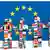 Symbolbild EU Flagge und Figuren, die aus den Flaggen der Mitgliedsländer bestehen (Foto: European Communities)