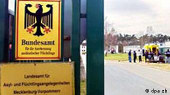 Door of regional authority that processes asylum seekers with sign of Germany's symbolic eagle