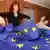 A woman unfurls an EU flag