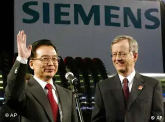 今年5月，冯皮埃尔在西门子总部欢迎中国总理温家宝