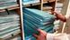 Two hands take out a pile of blue folders Two hands take out a pile of blue folders