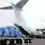 A cargo plane sits at Berlin Schoenefeld's Airport as it is in the process of being loaded
