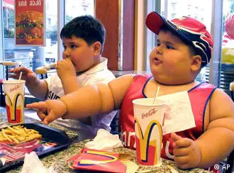 Obese children enjoy a meal at a McDonald's restaurant, Tbilisi, Georgia Republic, photo
