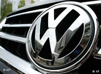 A close-up image of the VW logo on the front bumper of a car