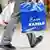 Shopper walking with a Karstadt bag