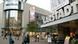 People walk outside a Karstadt department store People walk outside a Karstadt department store