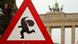 A street sign with an image of Santa Claus, in front of Berlin's Brandenburg Gate A street sign with an image of Santa Claus, in front of Berlin's Brandenburg Gate
