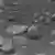 Huygens'in Titan'dan geçtiği ikinci fotoğrafta görülen cisimlerin buz parçaları olduğu sanılıyor