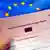 Visa form in front of EU flag