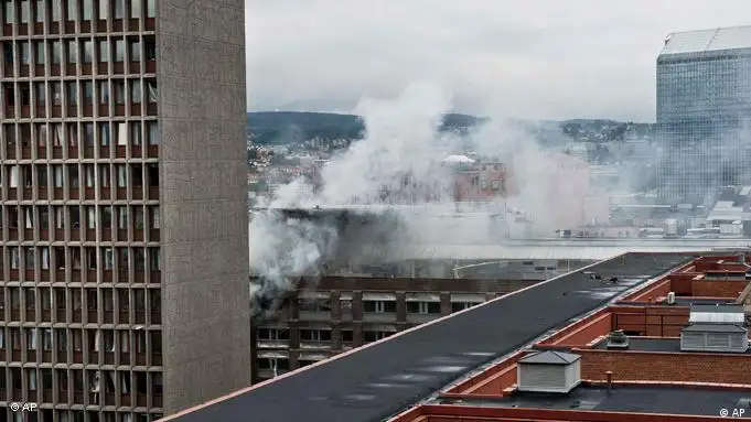 Smoke rises from buildings in Oslo, Norway, at the scene of a large explosion which tore apart several buildings Friday July 22, 2011. A loud explosion shattered windows Friday in several buildings including the government headquarters in Oslo which includes the prime minister's office, injuring several people. Prime Minister Jens Stoltenberg is safe, government spokeswoman Camilla Ryste told The Associated Press. The cause of the blast is not yet known. (AP PHOTO / Aleksander Andersen, Scanpix) NORWAY OUT