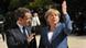 French President Sarkozy, left, welcomes German Chancellor Angela Merkel in Paris French President Sarkozy, left, welcomes German Chancellor Angela Merkel in Paris