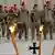 Bundeswehrsoldaten sind am Mittwoch (17.08.2011) in Kundus zu einem Appell zur Medaillenvergabe angetreten. Die Bundeswehr wird im Norden Afghanistans immer wieder in Gefechte verwickelt. Foto: Maurizio Gambarini dpa