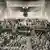 Adolf Hitler wird nach seiner Rede im Deutschen Reichstag in Berlin von allen Abgeordneten stehend mit Nazi-Gruss geehrt, hinter Hitler Reichstagspräsident Hermann Göring. Photographie 1938