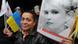 Protestor with photo of Yulia Tymoshenko Protestor with photo of Yulia Tymoshenko