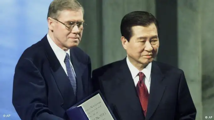 South Korea's President Kim Dae-jung, right, shows the diploma and the medal after he was awarded the 2000 Nobel Peace Prize by Gunnar Berge, chairman of the Norwegian Nobel Committee, during a ceremony in Oslo, Norway, on Sunday, Dec.10, 2000. Kim Dae-jung won the Nobel Peace Prize for pro-democracy activities and his efforts to reconcile with North Korea. (AP Photo/Heribert Proepper)