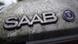 A Saab logo on a dirty Saab A Saab logo on a dirty Saab