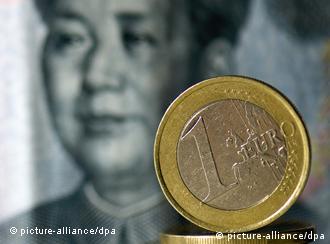 Symbolic photo: one-euro coin lying on Chinese ten- Yuan bank note