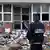 A police officer stands in front of the damaged offices of the satirical French newspaper Charlie Hebdo