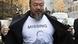 Chinese dissident artist Ai Weiwei opens his jacket to reveal a shirt bearing his portrait as he walks into the Beijing Local Taxation Bureau, China, Wednesday, Nov. 16, 2011. Ai went to the local tax bureau to fill in paperwork for a $1.3 million guarantee, and told reporters he feels like he was paying a ransom. (Foto:Andy Wong/AP/dapd) Chinese dissident artist Ai Weiwei opens his jacket to reveal a shirt bearing his portrait as he walks into the Beijing Local Taxation Bureau, China, Wednesday, Nov. 16, 2011. Ai went to the local tax bureau to fill in paperwork for a $1.3 million guarantee, and told reporters he feels like he was paying a ransom. (Foto:Andy Wong/AP/dapd)