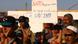 Libyans hold up signs with messages to NATO written on them Libyans hold up signs with messages to NATO written on them