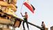 An Egyptian protester hangs an effigy representing Egypt's military ruler, Field Marshal Mohamed Hussein Tantawi An Egyptian protester hangs an effigy representing Egypt's military ruler, Field Marshal Mohamed Hussein Tantawi