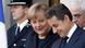 French President Nicolas Sarkozy, right, speaks with German Chancellor Angela Merkel, center French President Nicolas Sarkozy, right, speaks with German Chancellor Angela Merkel, center