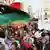 Men chant slogans during a protest in Benghazi, Libya