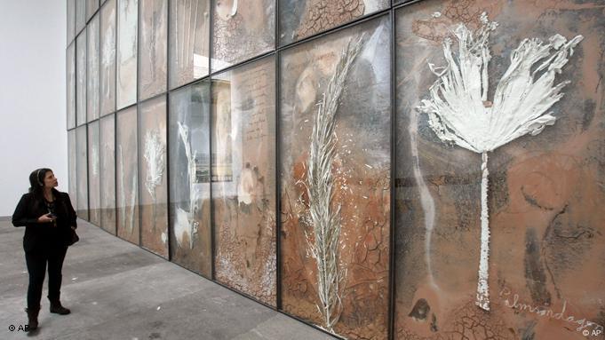 Anselm Kiefer work of very large panels next to each other and showing plant and leaf motifs.