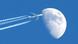 airplane flying against the moon airplane flying against the moon
