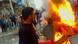 Man burning an object in Daraa, Syria Man burning an object in Daraa, Syria