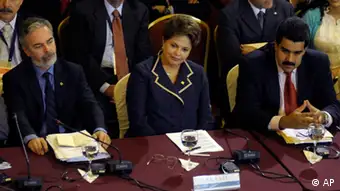 Brazil's Foreign Minister Antonio Patriota, left, Brazil's President Dilma Rousseff, center, and Venezuela's Foreign Minister Nicolas Maduro, left, look on as they attend the Mercosur summit in Montevideo, Uruguay,Tuesday, Dec. 20, 2011. South America's Mercosur trade bloc approved a Palestinian free trade deal Tuesday and then pushed to admit Venezuela as a full member, even at the cost of threatening its founding principles. (AP Photo/Matilde Campodonico)