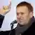 Opposition leader Alexei Navalny speaks during a rally to protest against alleged vote rigging in Russia's parliamentary elections