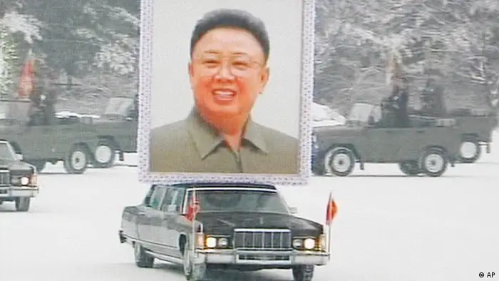 In this image made from KRT television, a huge portrait of late North Korean leader Kim Jong Il is carried in the snow during his funeral procession in Pyongyang, North Korea, Wednesday, Dec. 28, 2011. (AP Photo/KRT via APTN) TV OUT, NORTH KOREA OUT