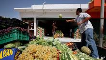 A Libyan vendor displays fruit in a shop in Tripoli, Libya, Sunday, Sept. 4, 2011. After days of shortages in the city some supplies are begining to come through. (AP Photo/Abdel Magid Al Fergany)