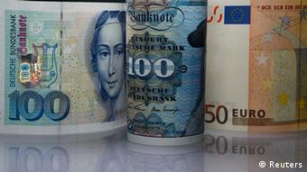 Deutschmark and euro banknotes