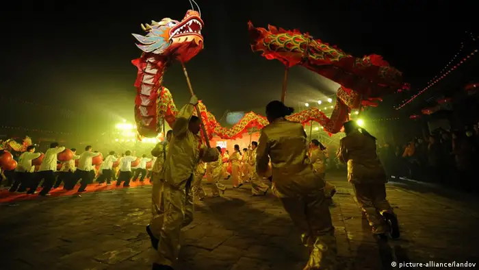 ZHENGZHOU, Jan. 1, 2012 (Xinhua) -- People play dragon dance to greet new year in Confucian Temple in Zhengzhou, capital of central China's Henan Province, Jan. 1, 2012. (Xinhua/Zhu Xiang) (zkr) XINHUA /LANDOV