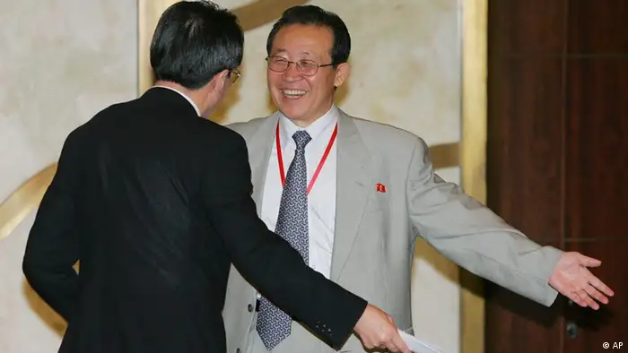 North Korean negotiator Kim Kye Gwan, right, and Chinese Vice Foreign Minister Wu Dawei gesture as they leave after the closing statement at the end of six party talks on the North Korean nuclear issue, in Beijing Friday July 20, 2007. Negotiators ended the talks by agreeing to meet again in September to outline a roadmap for Pyongyang's future disarmament following the shutdown of its sole reactor. (AP Photo/Greg Baker/Pool)
