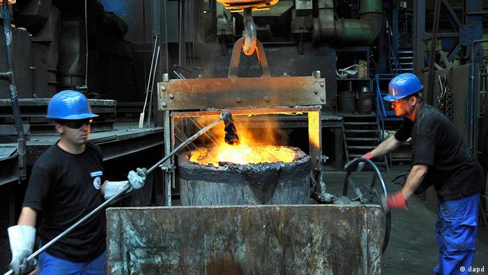 FILE - Employees work in the Schmiedeberger Giesserei foundry firm in Schmiedeberg, Germany, in this Aug. 5, 2009 photo. German industrial orders saw their second consecutive strong month-on-month rise in June, a 4.5 percent climb that was led by demand from other European countries, official figures indicated Thursday, Aug. 6, 2009. (ddp images/AP Photo/Matthias Rietschel, file)