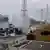 ARCHIV: Das Handout der Betreiberfirma Tokyo Electric Power zeigt Rauch, der aus dem Reaktor 3 des durch ein Erdbeben zerstoerten Atomkraftwerks Fukushima-Daiichi in Okumamachi aufsteigt (Foto vom 15.03.11). Um 14.46 Uhr an einem ganz normalen Freitagnachmittag standen die Uhren in Japan ploetzlich still. Ein verheerendes Erdbeben der Staerke 9.0 erschuetterte den Nordosten des Landes und loeste einen riesigen Tsunami aus. Teile der Kueste wurden dem Erdboden gleichgemacht und im Atomkraftwerk Fukushima-Daiichi bahnte sich die groesste Atomkatastrophe seit Tschernobyl an. Insgesamt kamen bei den Naturkatastrophen am 11. Maerz fast 16.000 Menschen ums Leben, mehr als 3.000 gelten nach wie vor als vermisst. (zu dapd-Text) Foto: AP/Tokyo Electric Power Co./dapd