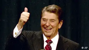 ** FILE ** President Ronald Reagan gives a thumbs-up to supporters at the Century Plaza Hotel in Los Angeles as he celebrates his re-election, Nov. 6, 1984, with first lady Nancy Reagan at his side. Reagan's win over Walter Mondale, 525 to 13 in the electoral vote and 59 percent to 41 percent in popular votes, was unquestionably a landslide election. (AP Photo/File)