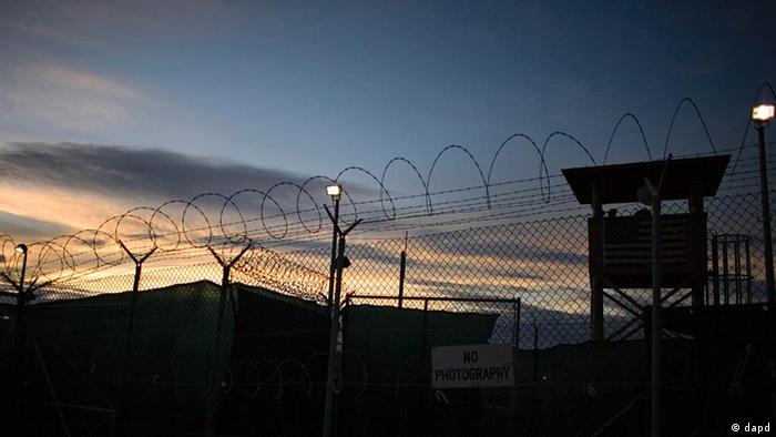 File - In this file image reviewed by the U.S. Military, the sun rises over Guantanamo detention facility, at the U.S. Naval Base, in Guantanamo Bay, Cuba, Nov. 19, 2008. The White House acknowledged for the first time Friday Sept. 25, 2009 that it might not be able to close the U.S. military prison at Guantanamo Bay by January as President Barack Obama has promised. Senior administration officials told The Associated Press that difficulties in completing the lengthy review of detainee files and resolving thorny legal and logistical questions mean the president's self-imposed January deadline may slip. (ddp images/AP Photo/Brennan Linsley, File)