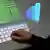 Computer der Zukunft - Virtuelle Tastatur und Bildgebung Professor Stefan Jähnichen bedient eine virtuelle Tastatur, die mittels eines Projektors auf einen Tisch geworfen wird. (Foto: DW/Sven Falge, 2011) BITTE AUCH IN NOFLASH-FORMAT