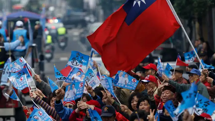 Supporters of Taiwan's President and presidential candidate Ma Ying-jeou wave flags during an election rally Tuesday, Jan. 10, 2012 in New Taipei City, Taiwan. Taiwan will hold its presidential election on Jan. 14, 2012.(AP Photo/Vincent Yu)